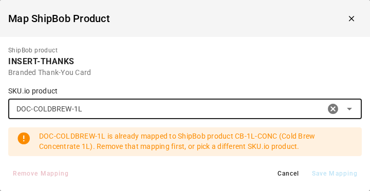 The Map ShipBob Product dialog warning that DOC-COLDBREW-1L is already mapped to ShipBob product CB-1L-CONC