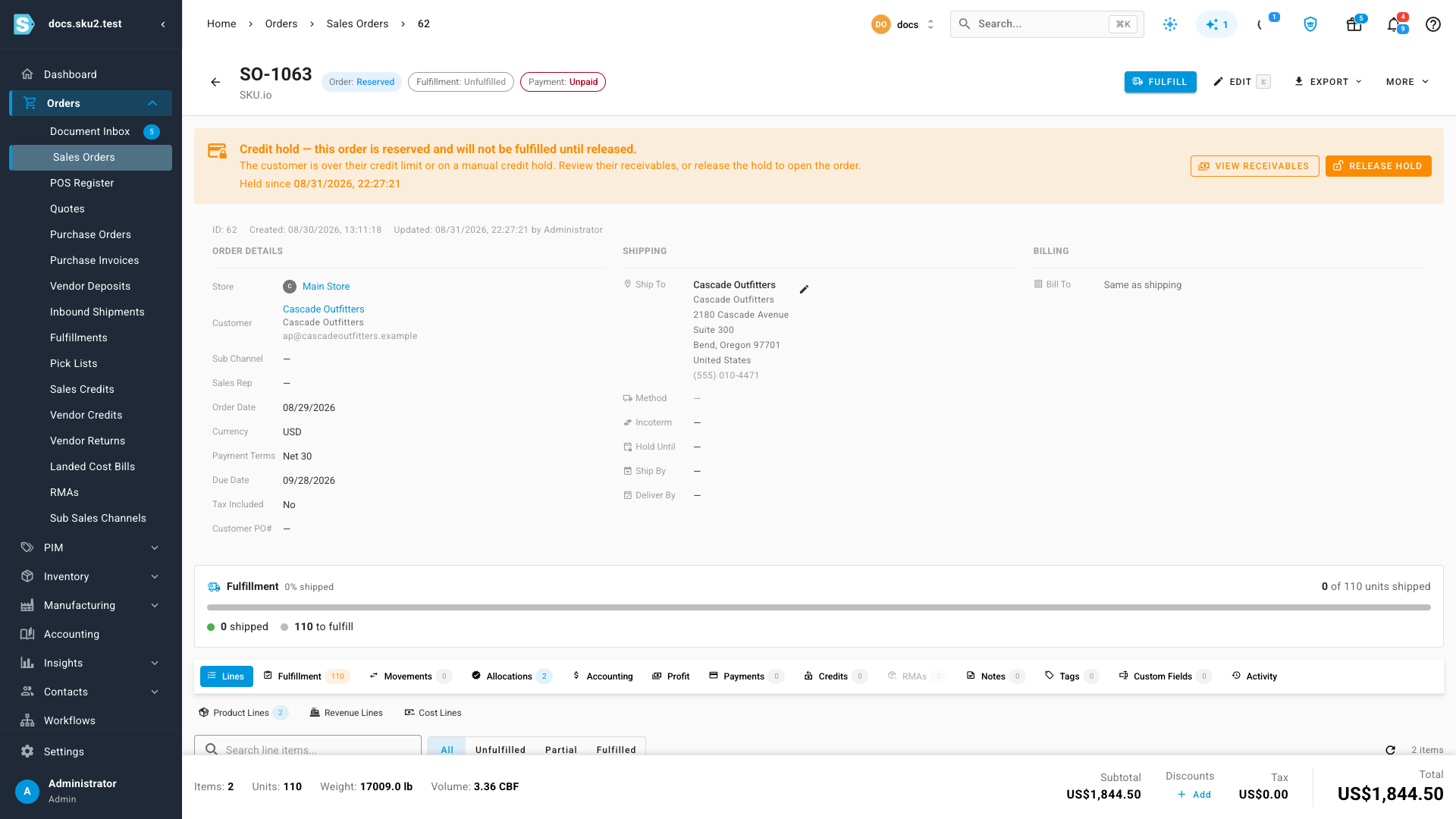 A sales order in Reserved status with an amber credit hold banner reading "Credit hold — this order is reserved and will not be fulfilled until released", with View Receivables and Release Hold buttons